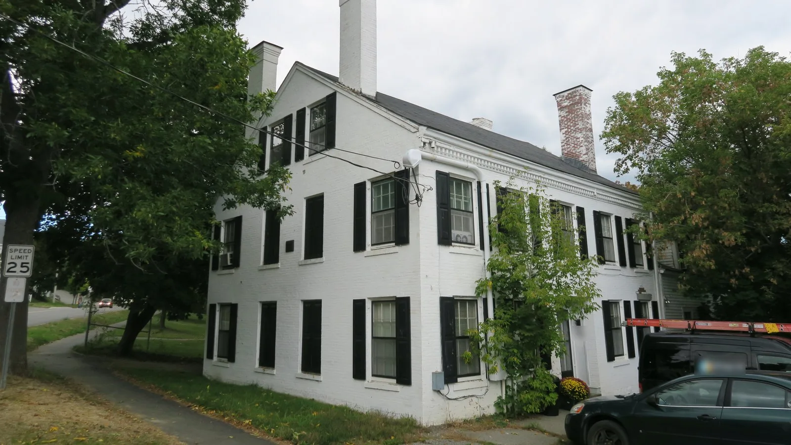 White brick two family house in Bangor, Maine, the kind of rental that can support a DSCR HELOC