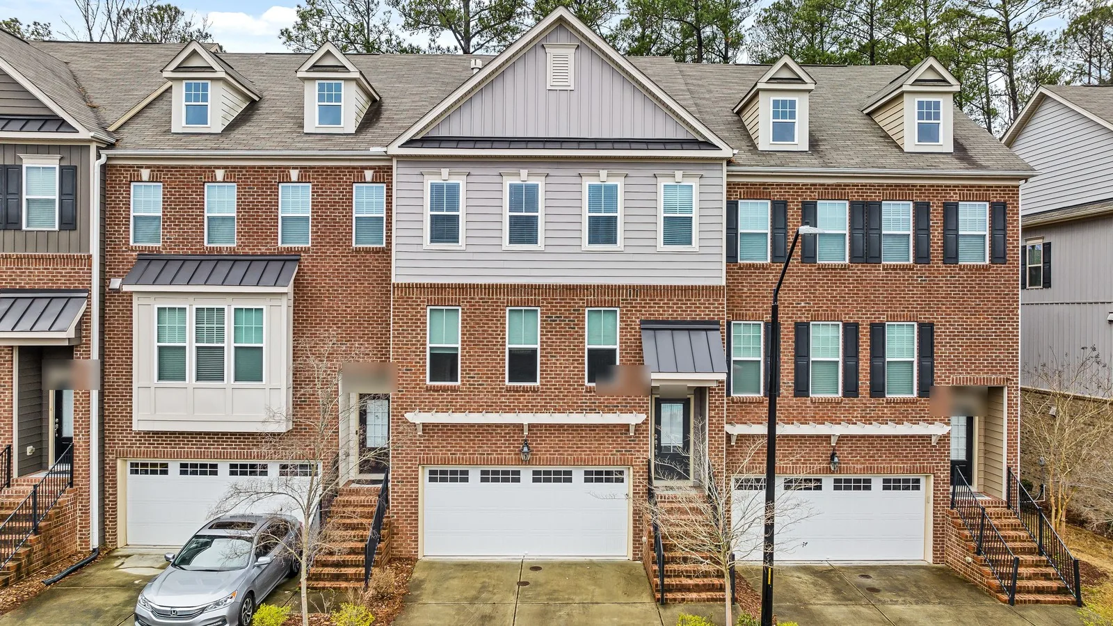 Row of townhomes with garages for comparing a DSCR loan vs a HELOC