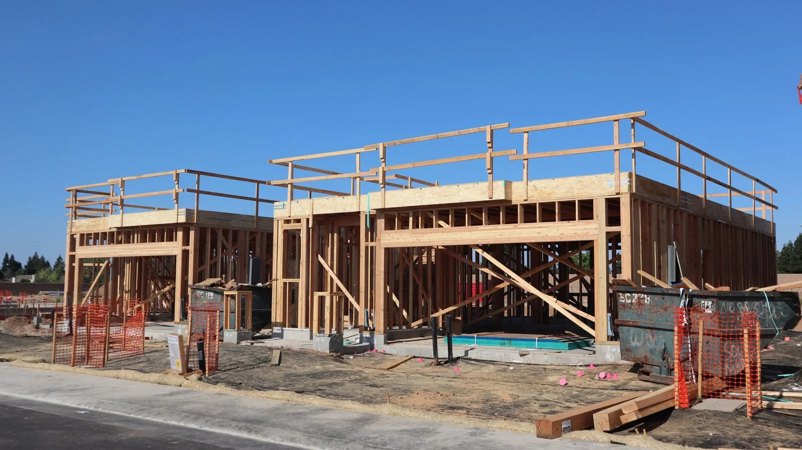 Wood framing of a new house under construction, the stage a one-time close construction loan pays for in draws