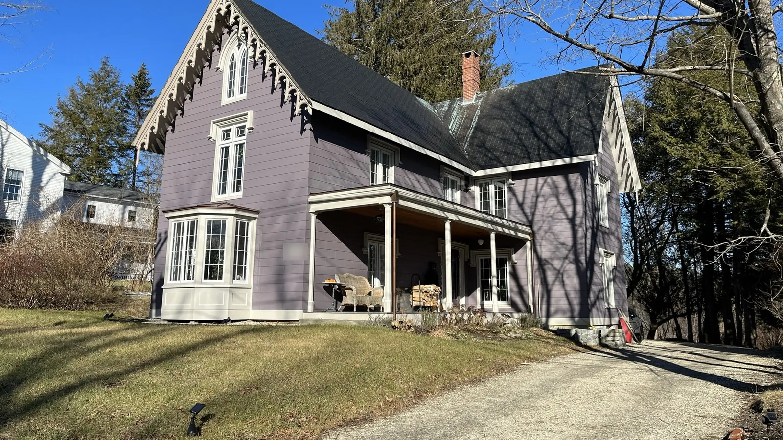 Lavender Gothic Revival home with a front porch in Yarmouth, Maine