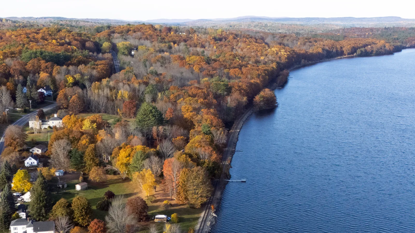 Aerial view of Maranacook Lake and lakeside homes in Winthrop, Maine, in fall color