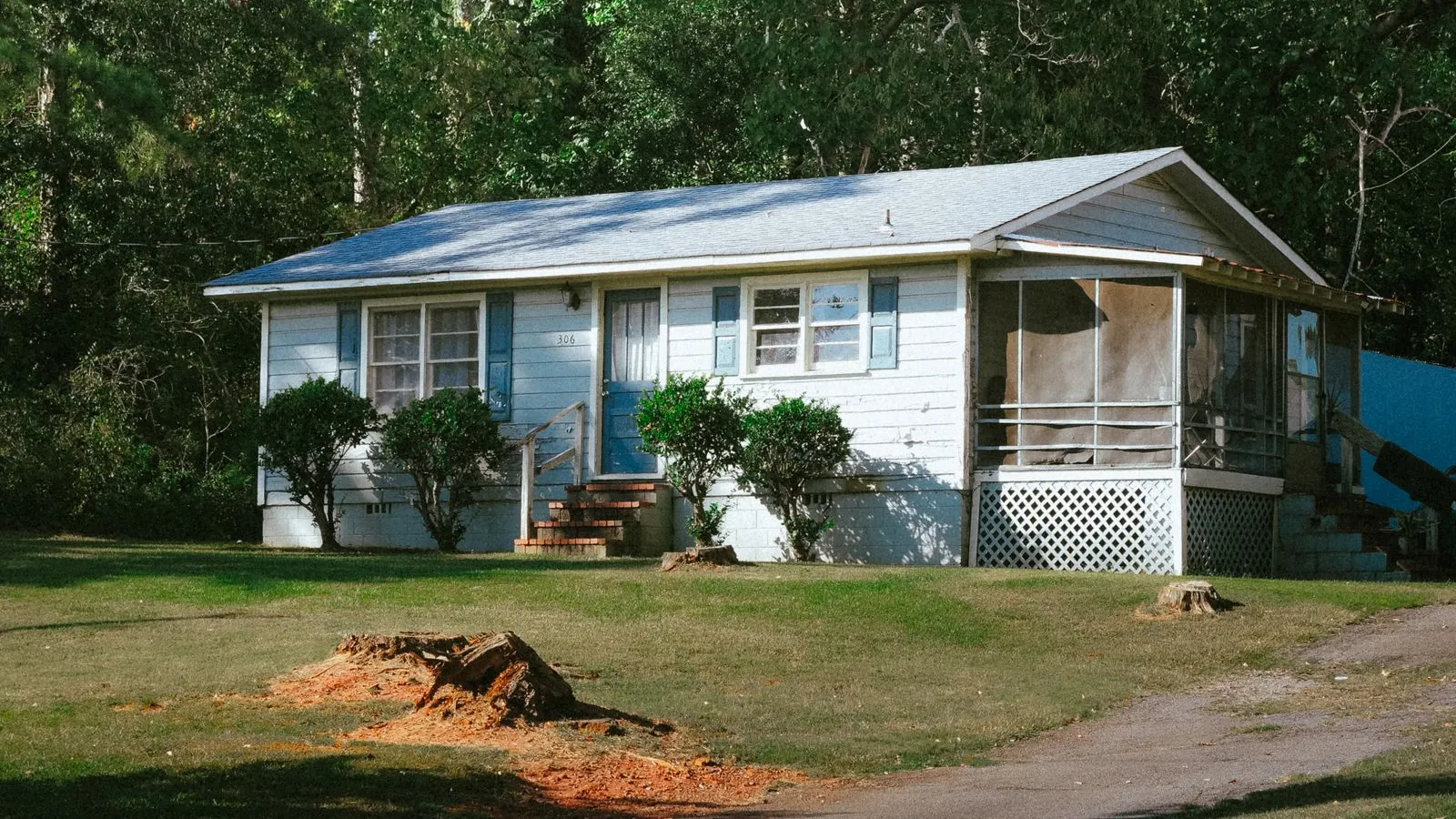 Small blue gray house with a front porch in Atlanta