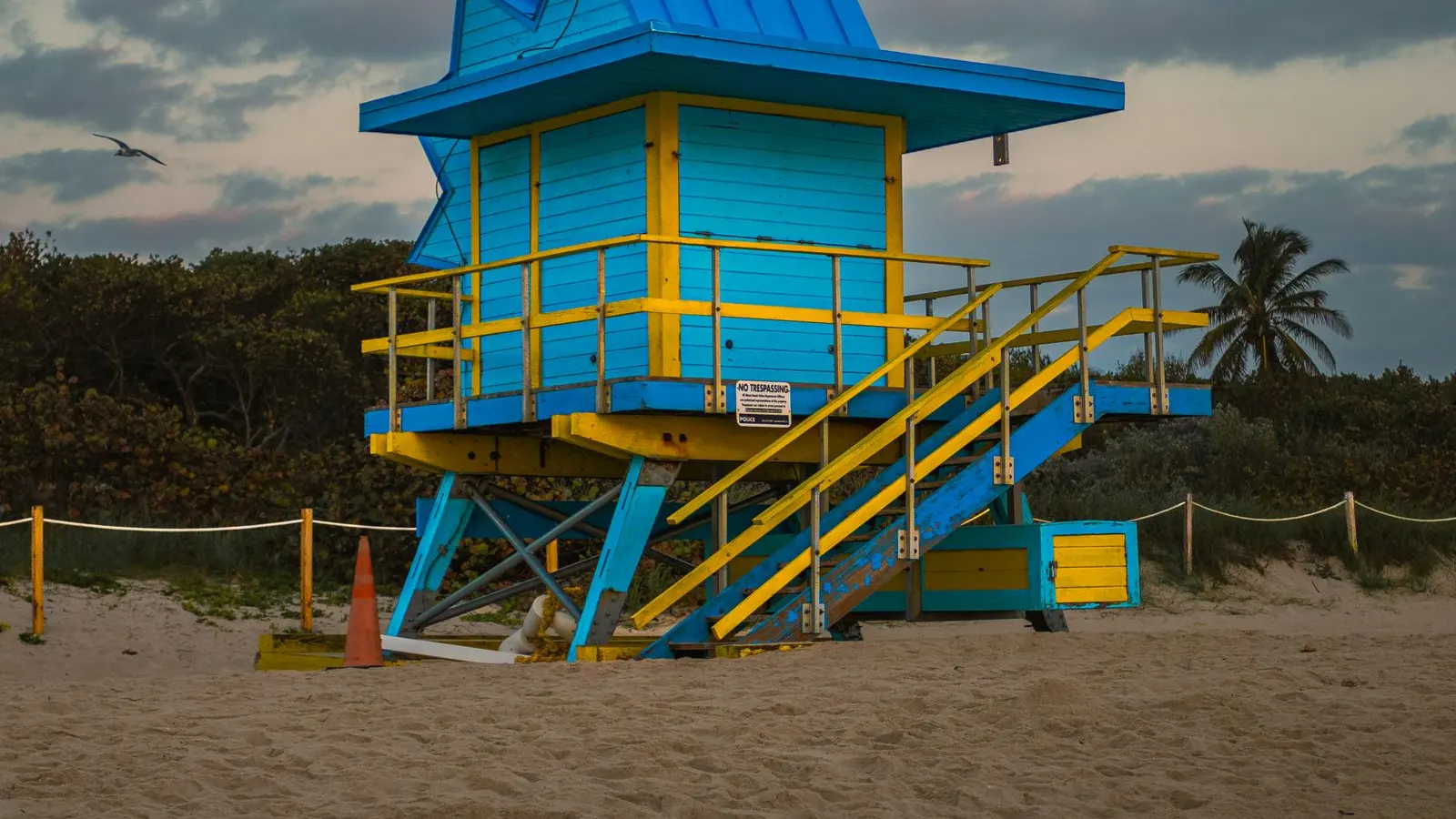 Blue lifeguard stand on a Florida beach at dusk