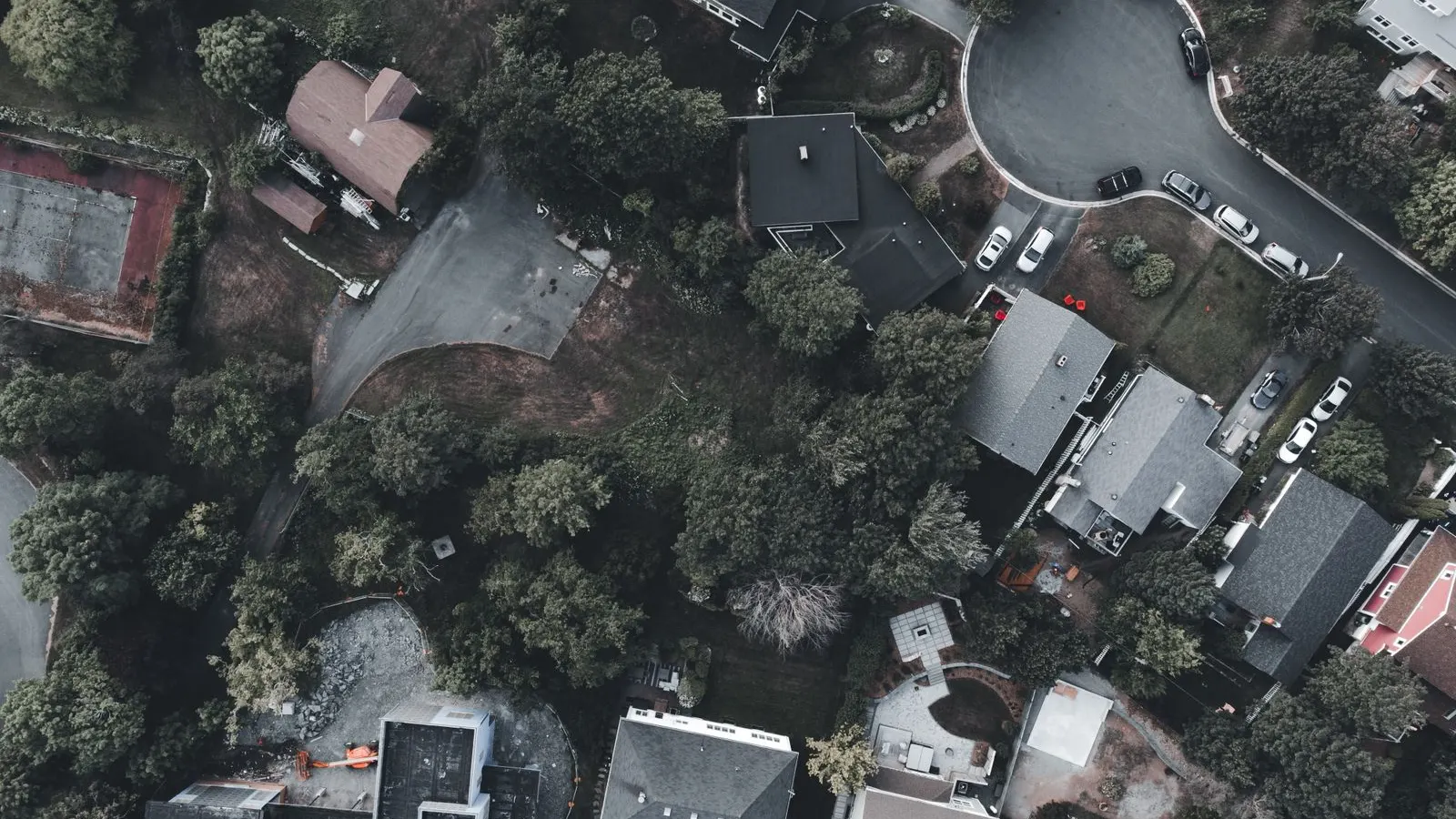 Rooftops of a wooded neighborhood from above