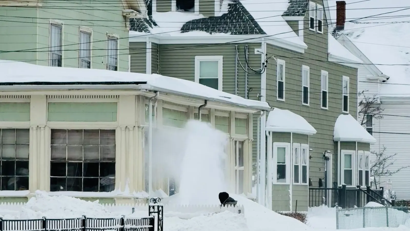 Victorian homes on a snowy street in Somerville, Massachusetts