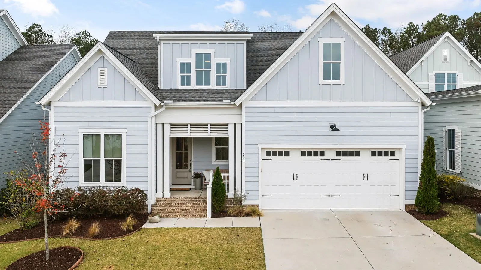 White two story home with a double garage