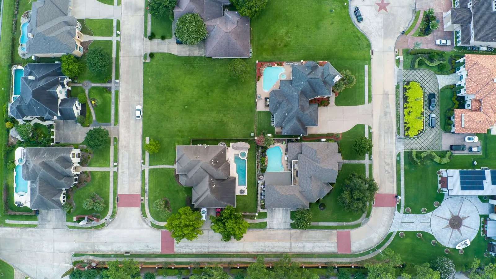 Homes with backyard pools from above