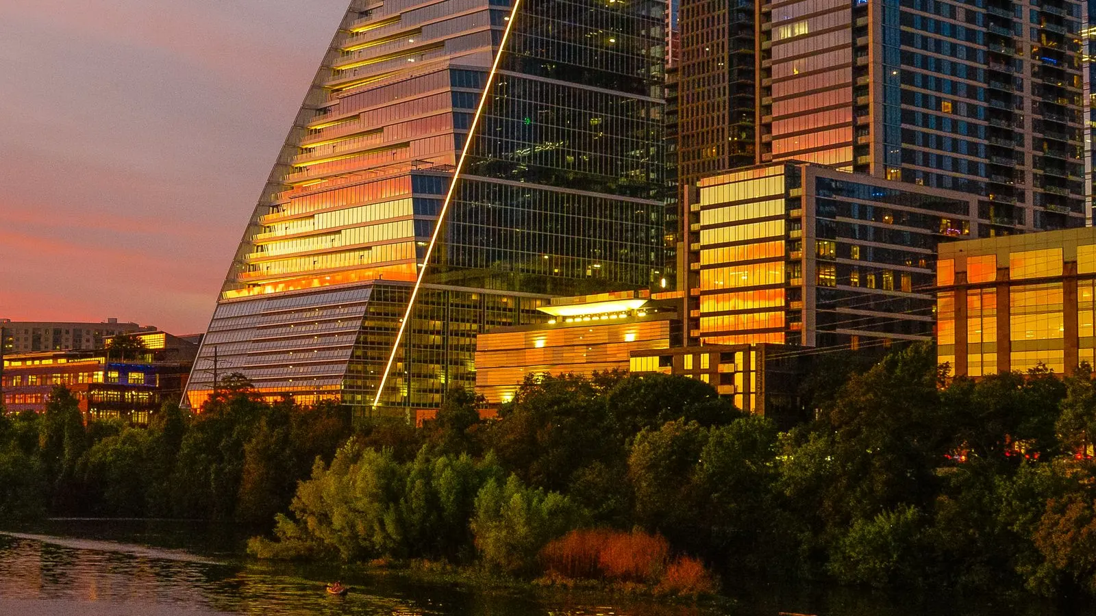 Austin high rises reflected in the river at dusk