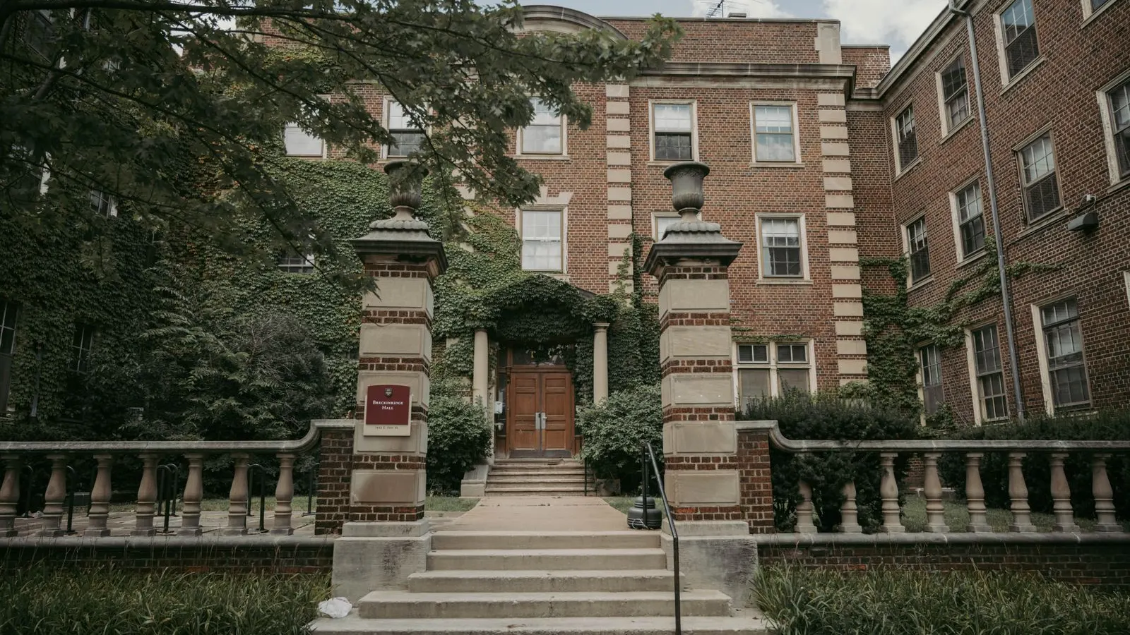 Ivy covered brick building with a stone stairway