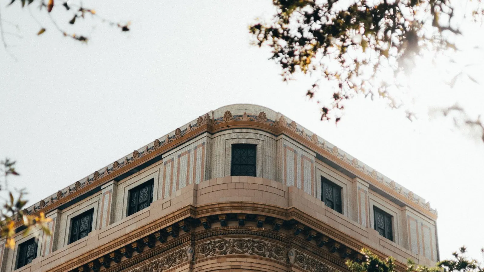 Historic building framed by trees in Savannah