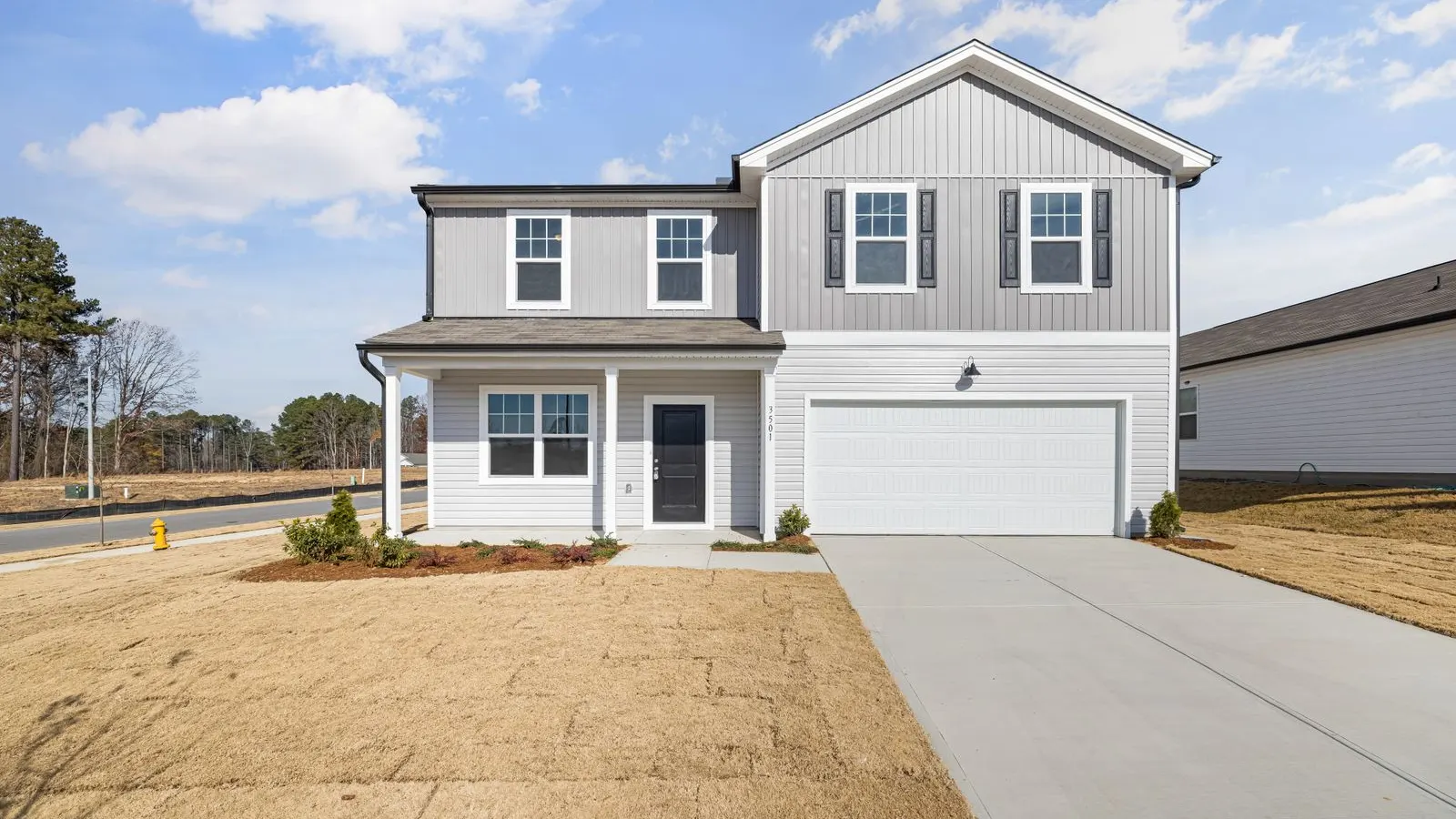 New two story house with a garage on a fresh lot
