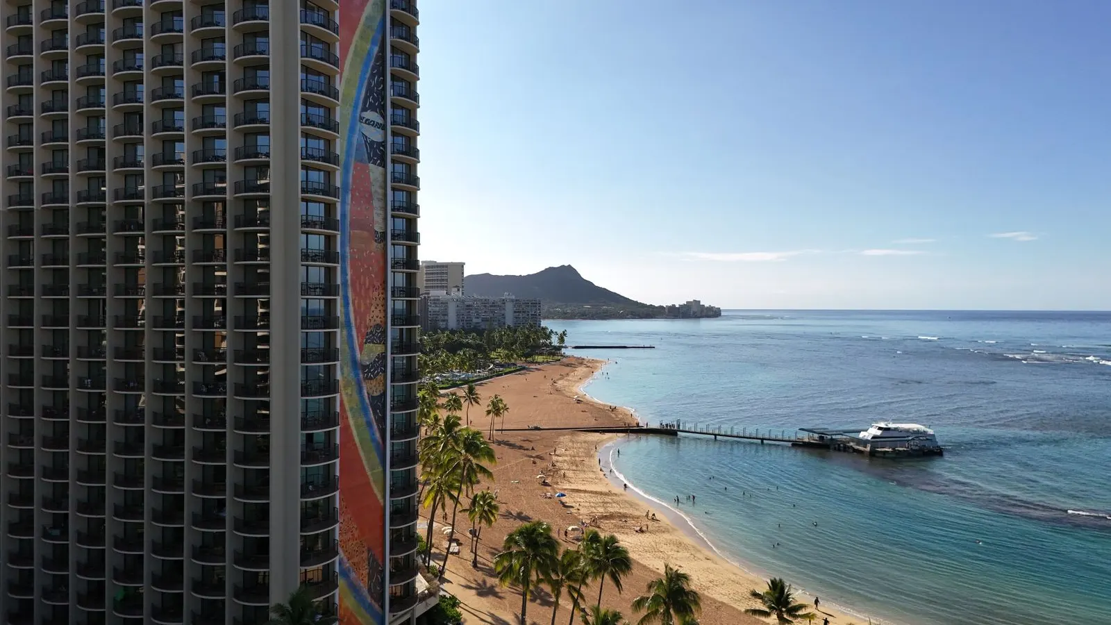 Waikiki Beach and Diamond Head beyond a high rise
