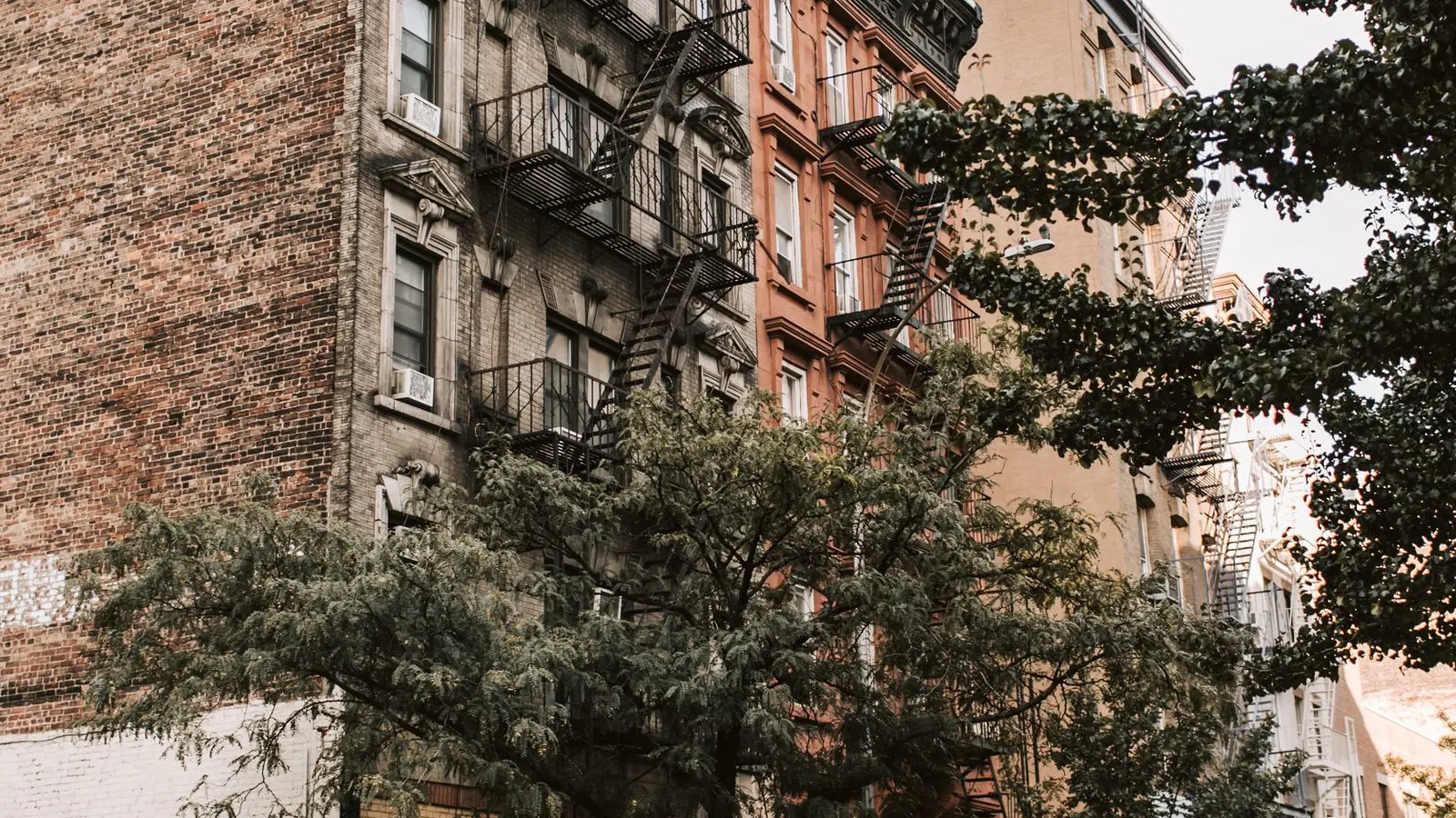 Older walk up apartment buildings on a New York street