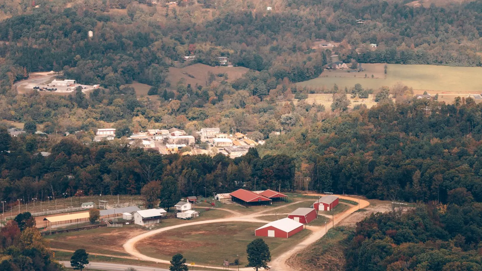 New homes spread over rolling hills from above