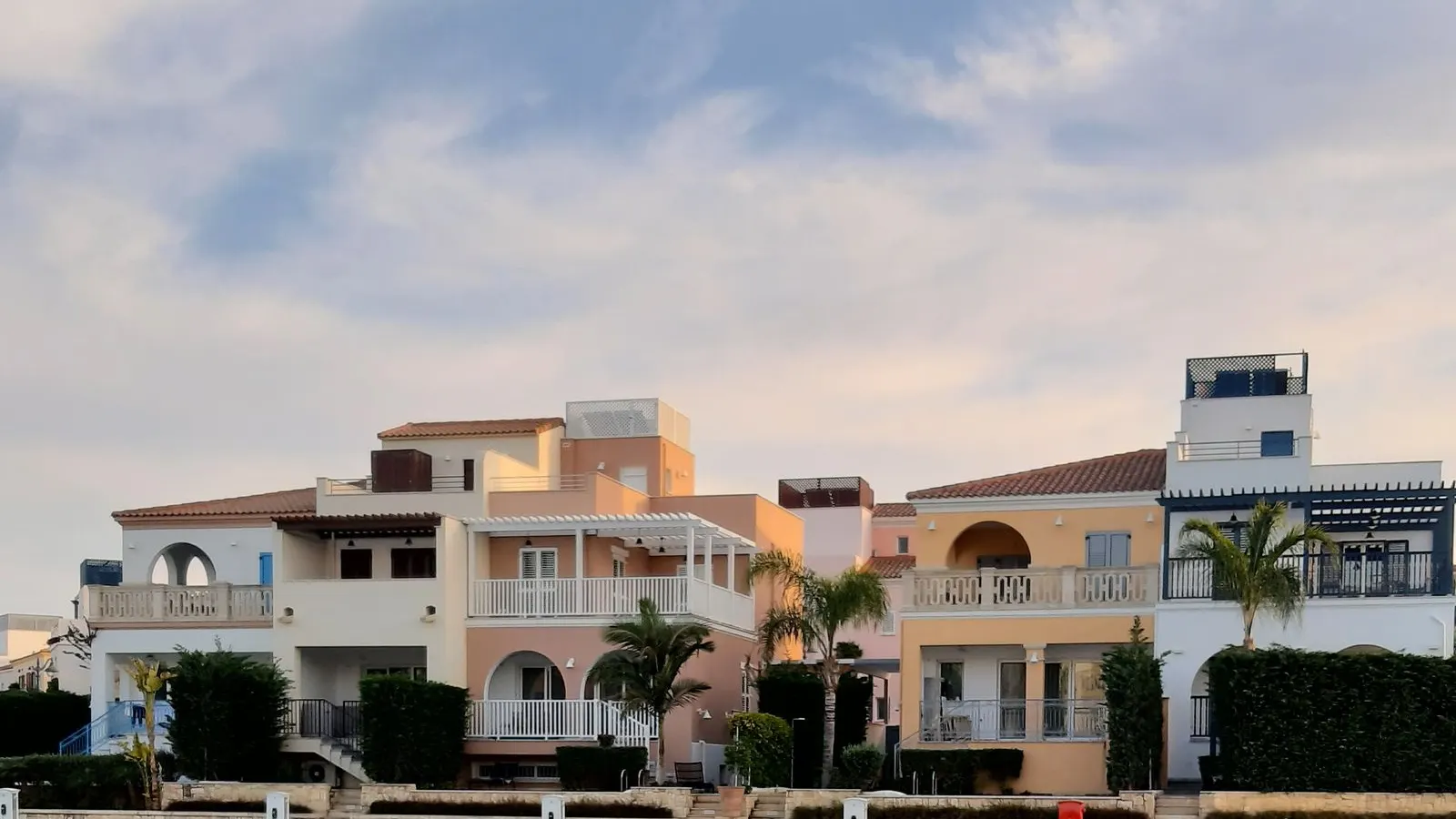 Homes reflected in a calm Cape Coral canal
