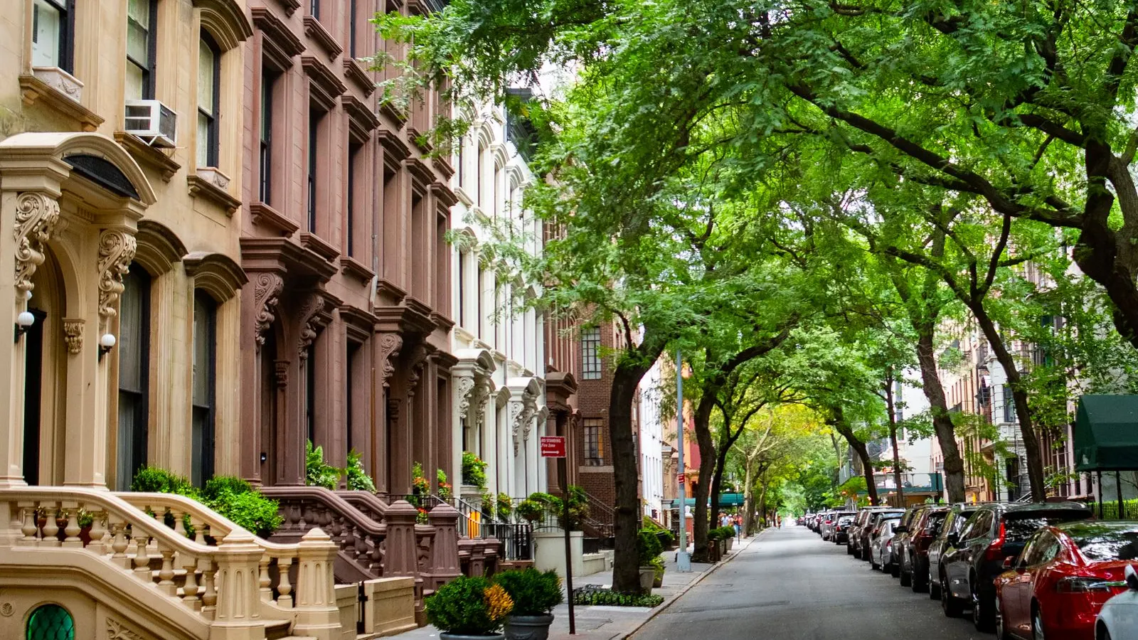 Brooklyn brownstone street under summer trees