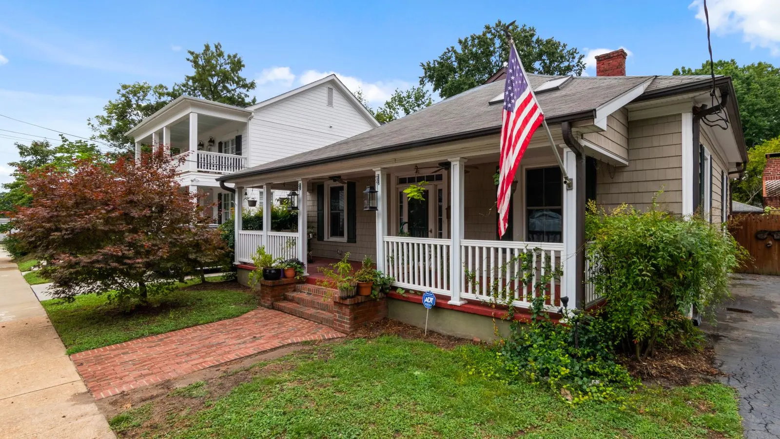 Bungalow with an American flag on the front porch
