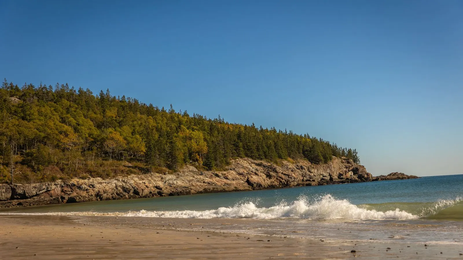 Waves rolling onto the shore in Acadia National Park